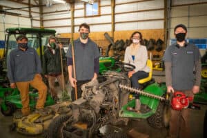 Nikki Wegner poses with Chinook's Grounds Maintenance Crew