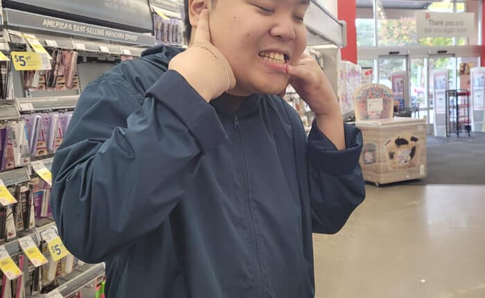 Photo of a smiling John at Walgreens where he got his first job