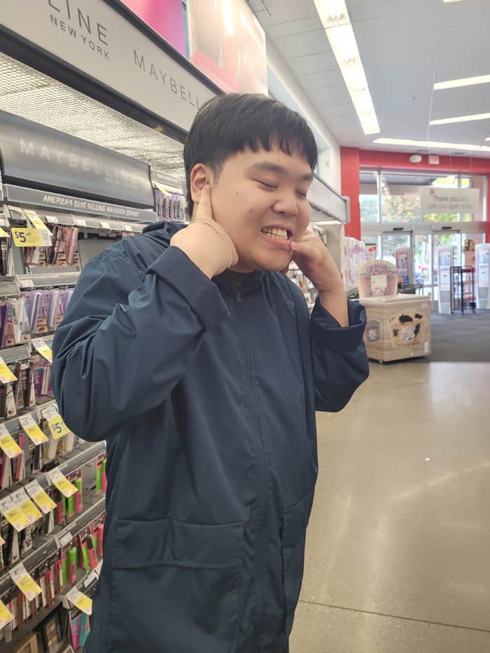 Photo of a smiling John at Walgreens where he got his first job