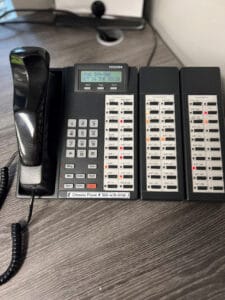 Picture of our outdated phone technology that needs a big upgrade on Giving Tuesday 2023